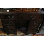 Reproduction 18th Century style mahogany pedestal writing desk with central cupboard and a bank of