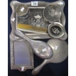 Silver and tortoiseshell pique dressing table set comprising; tray, brush, mirror, comb, jar etc.