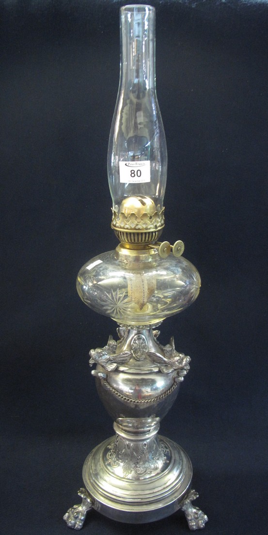 Early 20th Century brass double burner oil lamp with cut clear glass reservoir on a vase shaped