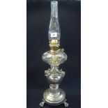 Early 20th Century brass double burner oil lamp with cut clear glass reservoir on a vase shaped