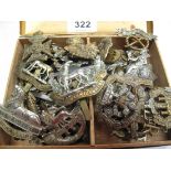 Tin box containing assorted cap badges various to include; Lincolnshire, Royal Warwickshire,