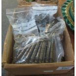 A box containing assorted brass and other furnishing accessories, handles, brackets etc. (B.P.