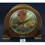 Mid 20th Century three train arched mantel clock with brass Roman face. (B.P. 24% incl.