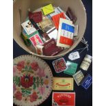 A collection of match cards and boxes and an embroidered box (B.P. 24% incl.