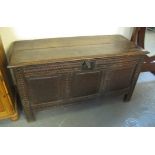 17th/18th Century oak coffer having three fielded and moulded panels and carved decoration on stile