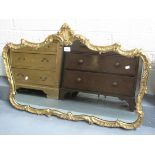 Modern gilt framed mirror of rectangular form with relief moulded feather pediment. (B.P. 24% incl.