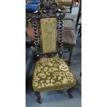 19th Century walnut prie dieu chair on barley twist supports and carved decoration and casters. (B.