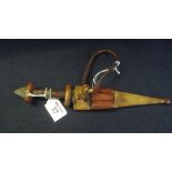 Small African dagger with leather hilt having reverse blade and snakeskin covered scabbard. (B.P.
