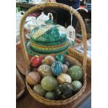 Small wicker basket containing assorted specimen hardstone eggs, malachite, onyx etc. (B.P.