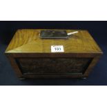 19th Century mahogany and burr elm sarcophagus shaped tea caddy with panelled front on bun feet. 30.