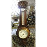 Early 20th Century carved oak aneroid barometer. (B.P. 24% incl.