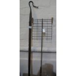 Metal shepherd's crook with wooden stale, together with a metal whey skimmer with wooden handle.