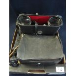 Two pairs of binoculars, a telescope and a gas mask in its original box and case. (B.P. 24% incl.