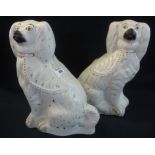 Pair of late 19th Century Staffordshire pottery seated over gilded white spaniels with painted