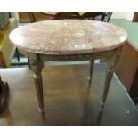 Small marble top occasional table of oval form with gilded frame and tapering legs. (B.P. 24% incl.