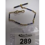 Yellow metal and blue enamel Victorian watch chain, approx. weight 6.45g. (B.P. 24% incl.