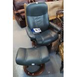 Modern Stressless green leather swivel armchair and matching footstool. (B.P. 24% incl.