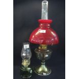 Plated oil lamp with overlay glass deep red shade and clear chimney,