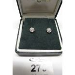 A pair of diamond cluster earrings. (B.P. 24% incl.