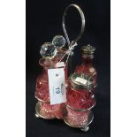 Silver plated and cranberry glass four section cruet set on stand. (B.P. 24% incl.