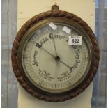Early 20th Century carved oak wall barometer of circular form. (B.P. 24% incl.