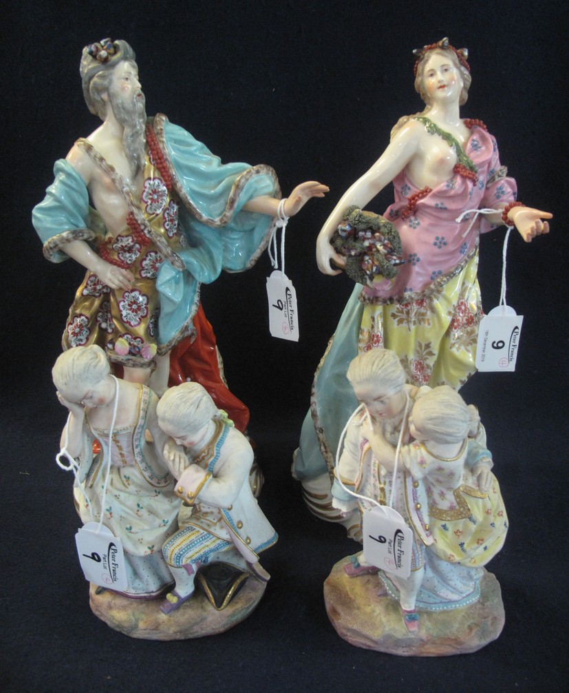 Pair of Meissen style figurines of a man and woman in classical robes,