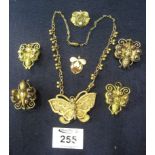 Two pairs of gold plated brass pendants and a filigree butterfly pendant. (B.P. 24% incl.