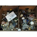 Two boxes of assorted glass and porcelain scent bottles to include; cut glass, marbled glass,