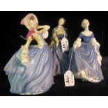 Three Royal Doulton bone china figurines to include; 'Autumn Breezes' HN3736,