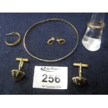 A 9ct gold bangle and pair of cufflinks set with tiger's eye etc. (B.P. 24% incl.