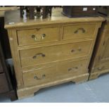 Pine straight front chest of two short and two long drawers with reeded columns on bracket feet.