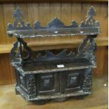 Carved oak small shelving unit with relief moulded foliage. (B.P. 24% incl.