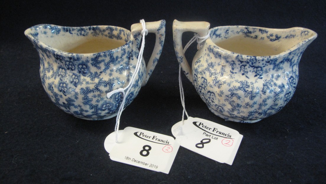 Pair of 19th Century transfer printed Llanelly pottery blue and white cream jugs in the seaweed