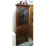 Edwardian mahogany astragal glazed two stage corner cabinet on bracket feet. (B.P. 24% incl.