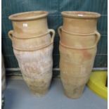 A pair of large terracotta two handled garden pots or planters. (2) (B.P. 24% incl.