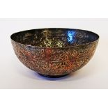 A Persian, Qajar Dynasty, Islamic tinned copper bowl, with a round pedestal base. The surface is