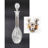 A crystal decanter with stopper H35cm together with three metal bottle stoppers with cork (5)