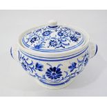 A Cypriot Ermis ceramic soup tureen and cover, hand decorated with blue and white floral sprays,