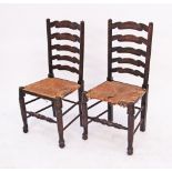 A pair of French style ladder back provincial side chairs with straw seats on turned supports