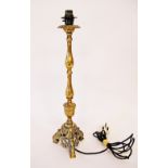 A large Italian style brass candlestick converted to a table lamp, early 20th century. H49cm