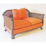 A French style carved walnut and caned two seater sofa, late 19th / early 20th century W138cm,