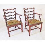 A set of 2 Chippendale style mahogany dining armchairs, ladder back shaped head rails and pierced