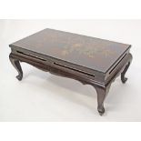 Chinese lacquered long low table with open carved shaped frieze, raised on cabriole legs, the top