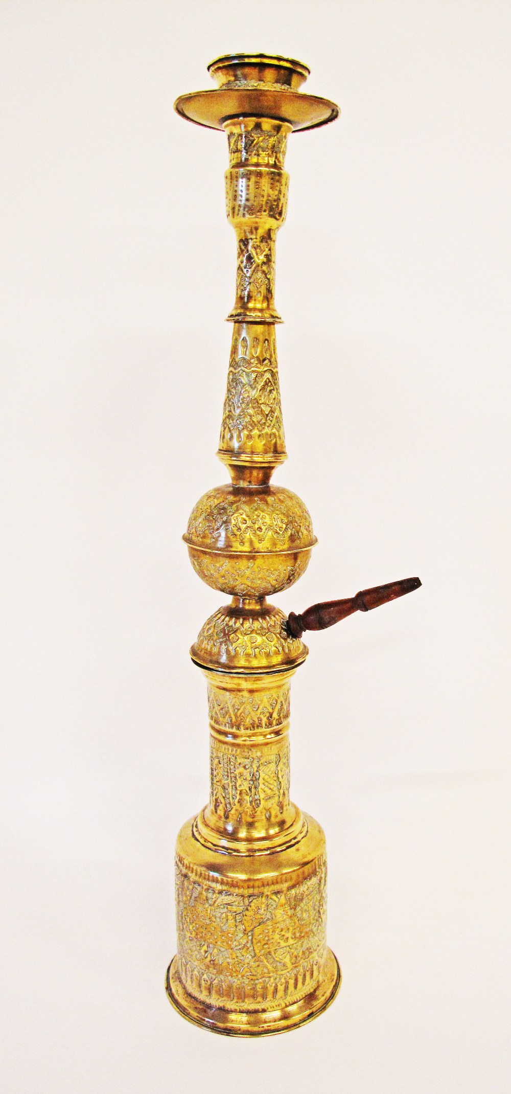 A large Persian brass hookah / nargile with repousse and engraved decorations, circa late 19th /