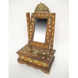 A Syrian silver and mother of pearl inlaid hardwood mirror stand with drawer. W31cm, D20cm, H52cm