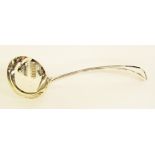 A silver plated soup ladle.