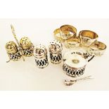 An English reticulated silver plated cruet set comprising a pair of salt & pepper on stand,