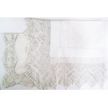 Two embroidered cotton tablecloths with crochet lace edgings of 25cm and 14cm width. One table cloth