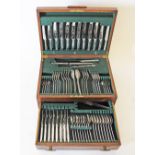 A figured walnut canteen case with silver plated cutlery by DIXONS Sheffield, set of eight,