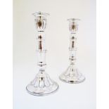 A pair of Cypriot silver candlesticks, hallmarked KAL 830, decorated with engraved lines. H19cm,